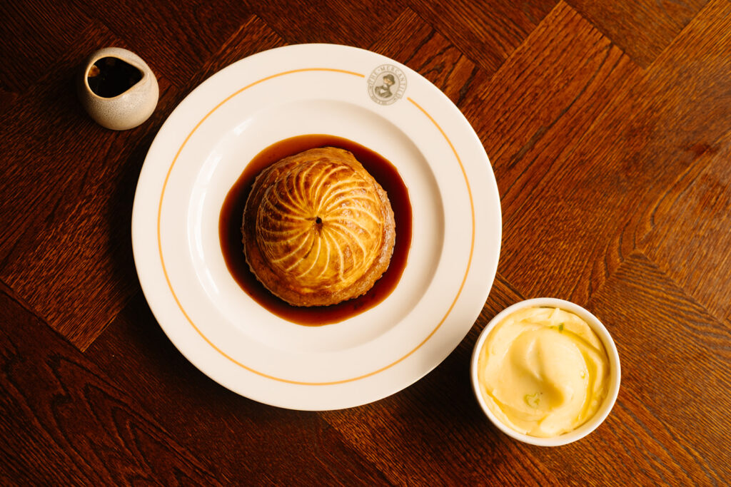 BEEF & GUINNESS PITHIVIER, served with champ potato, smoked bone marrow gravy from The Mercantile Hotel, the best food in the city . If you're looking for where to eat in Dublin, save your spot here 